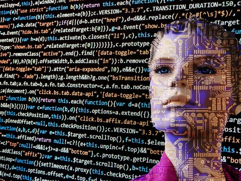 Codes and circuits drawn over a woman's face representing artificial intelligence.