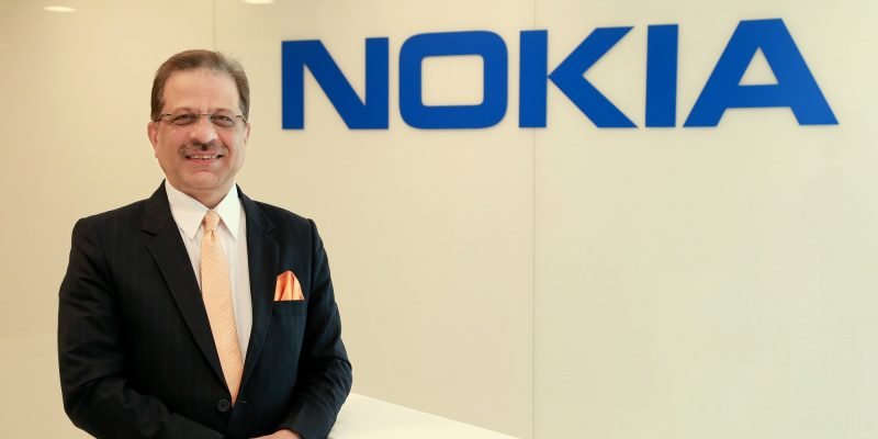 Nokia Senior Vice President and Head of India Market Sanjay Malik with NOKIA logo in the background.