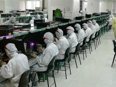 Workers at an electronic component factory