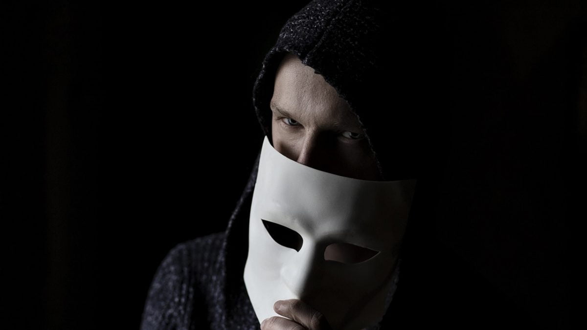 A man holding mask. DoT Uses AI to Flag Fraudulent