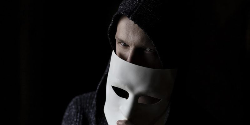 A man holding mask. DoT Uses AI to Flag Fraudulent